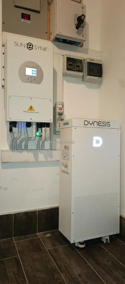 A Sunsynk hybrid inverter beside a floor-standing Dyness battery.
