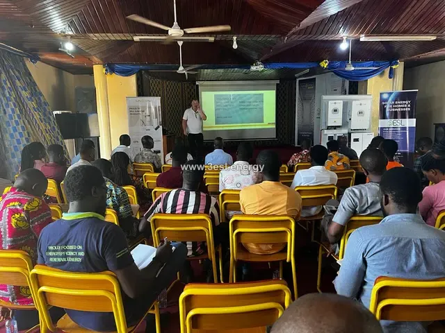 Installers seated in a classroom watching a presentation during Sunsynk training.